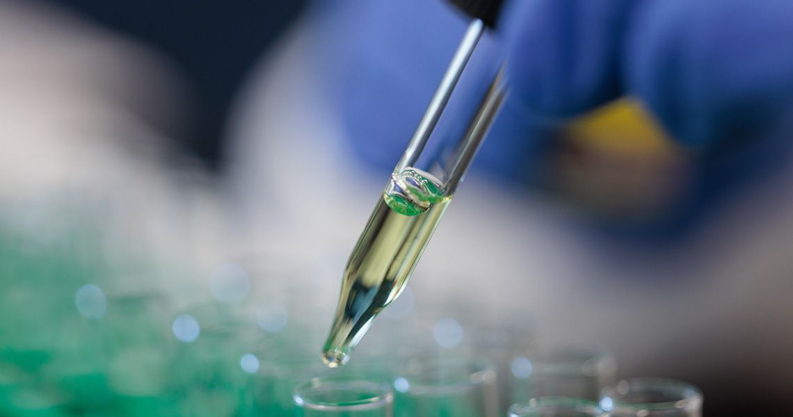 Close up of laboratory scientist performing genetic testing.
