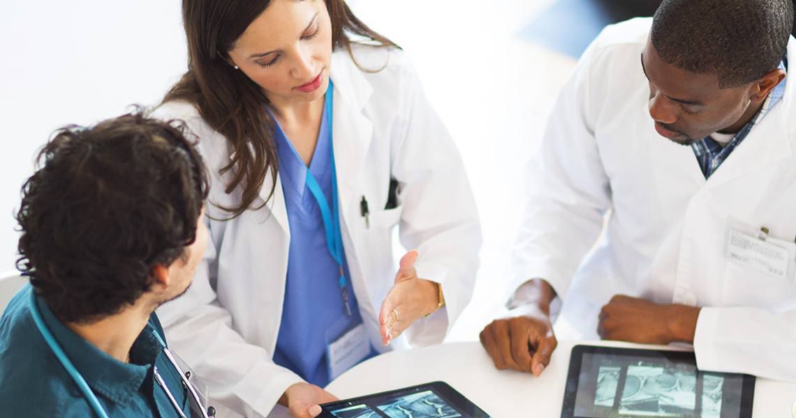 doctors sitting at a table talking