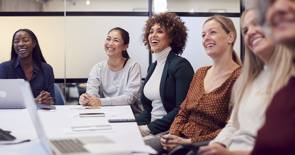 people sitting around a conference table meeting