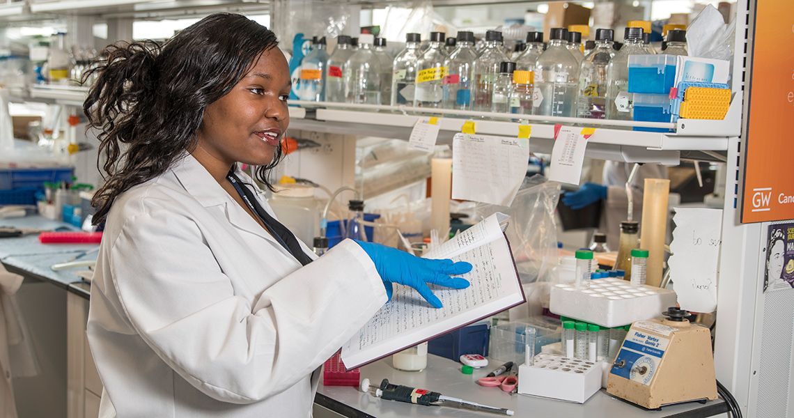 A female researcher is shown with a notebook