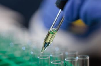 Close up of laboratory scientist performing genetic testing.]  