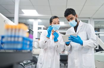 Biomedical Laboratory Scientists reviewing lab tests
